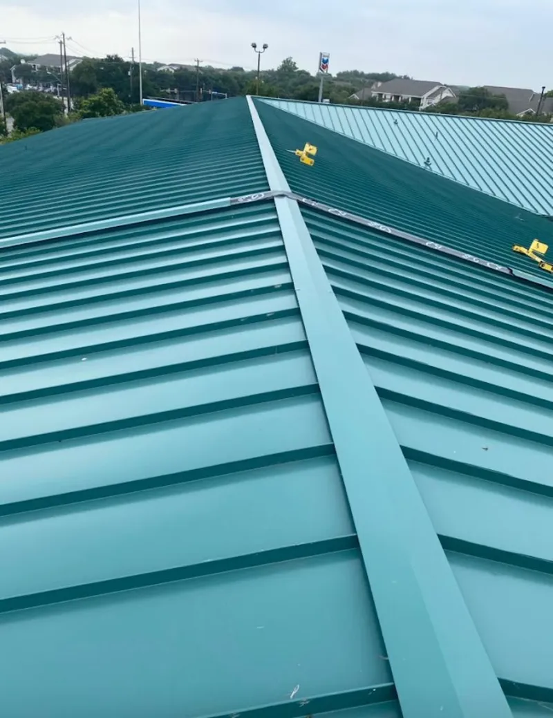 Green commercial metal roof ridge and valley for Metal Roof Repair in Brambleton